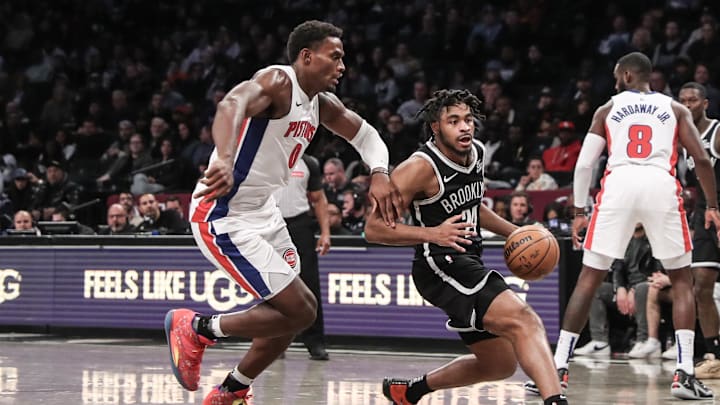 Nov 3, 2024; Brooklyn, New York, USA;  Brooklyn Nets guard Cam Thomas (24) drives past Detroit Pistons center Jalen Duren (0) in the fourth quarter at Barclays Center. Mandatory Credit: Wendell Cruz-Imagn Images