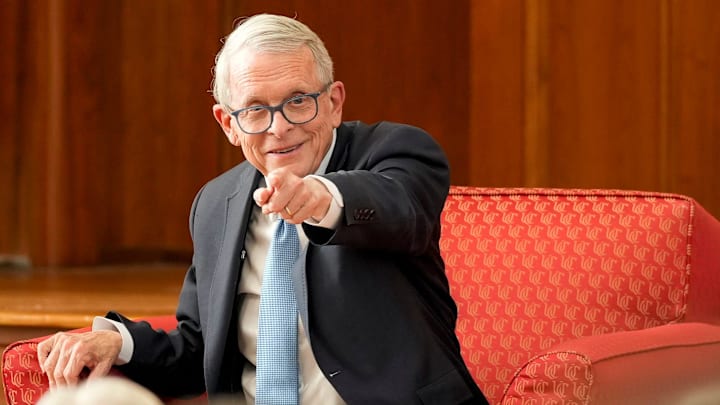 Ohio Gov. Mike DeWine is introduced at the start of an event at the University of Cincinnati's Portman Center for Policy Solutions in Cincinnati on Tuesday, Oct. 21, 2025.