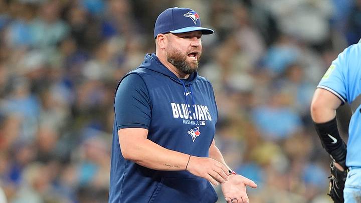 Toronto Blue Jays manager John Schneider visits the pitching mound during the eighth inning against the Kansas City Royals at Rogers Centre.  Credit: John E. Sokolowski-Imagn Images