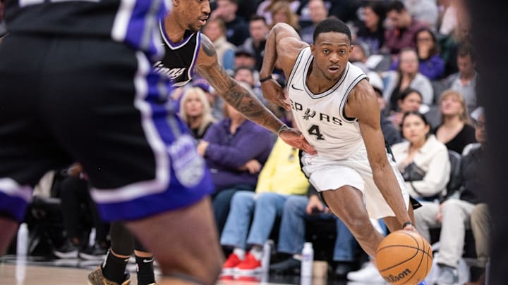 Mar 7, 2025; Sacramento, California, USA; San Antonio Spurs guard De'Aaron Fox (4) drives to the basket against the Sacramento Kings during the fourth quarter at Golden 1 Center. Mandatory Credit: Ed Szczepanski-Imagn Images