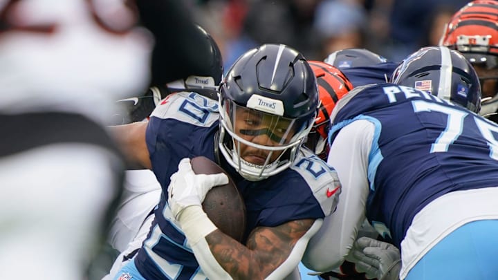 Tennessee Titans running back Tony Pollard (20) runs for a first down during the first quarter at Nissan Stadium in Nashville, Tenn., Sunday, Dec. 15, 2024.