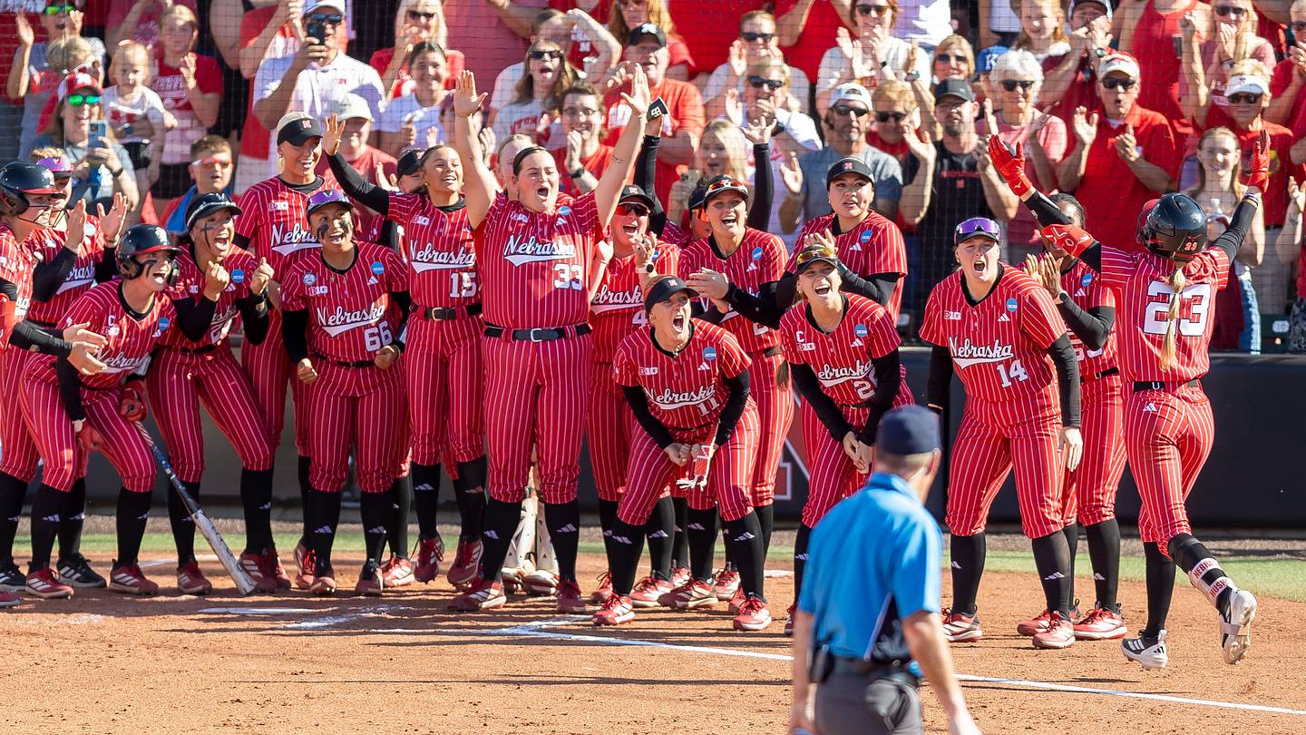 Nebraska softball celebrates a 9-1 sweep of Oklahoma State to clinch the Lincoln Super Regional