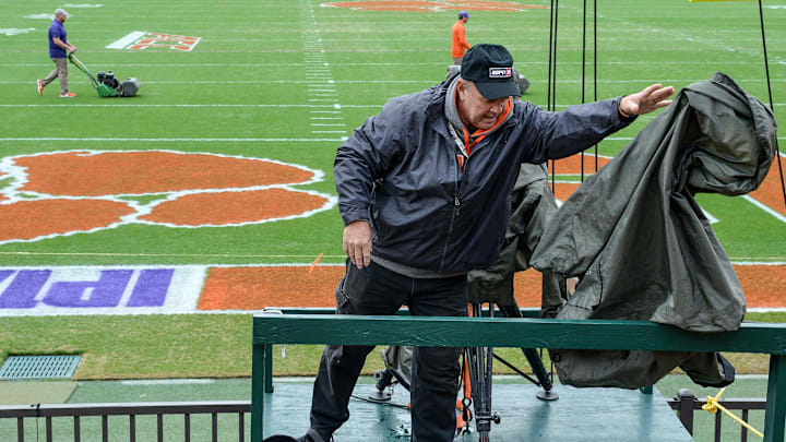 Bob Schuster, an ESPN television cameraman from Anderson County, tosses a rain cover to the side as he gets ready hours before kickoff inside Memorial Stadium, before the South Carolina at Clemson football game, in Clemson on Saturday, November 24, 2018.
