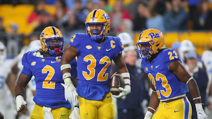 Pittsburgh Panthers Shayne Simon (32) celebrates with his teammates after recovering a fumble during