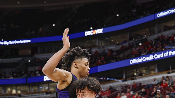 Mar 12, 2026; Chicago, IL, USA; Wisconsin Badgers guard Braeden Carrington (0) drives to the basket against Washington Huskies guard Courtland Muldrew (30) during the second half at United Center. Mar 12, 2026; Chicago, IL, USA; Wisconsin Badgers guard Braeden Carrington (0) drives to the basket against Washington Huskies guard Courtland Muldrew (30) during the second half at United Center.