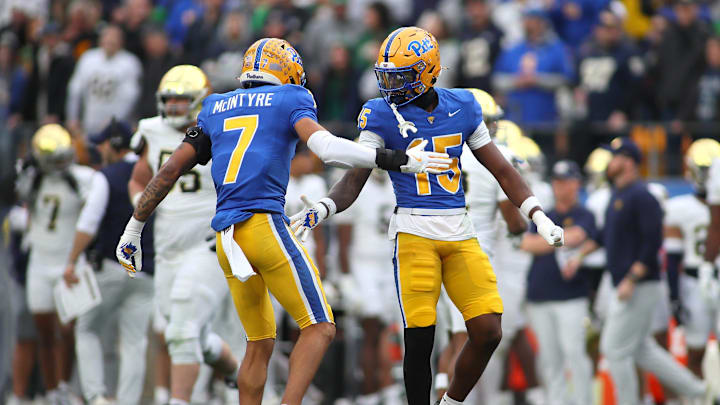 Pittsburgh Panthers defensive back Rashad Battle (15) celebrates breaking up a pass with Pittsburgh Panthers defensive back Javon McIntyre (7) during the first half against the Notre Dame Fighting Irish at Acrisure Stadium in Pittsburgh, PA on November 15, 2025.