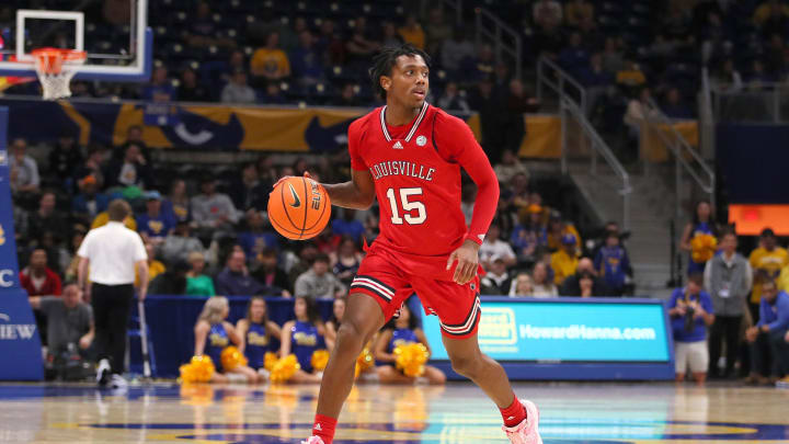 Louisville Cardinals Hercy Miller carries the ball downcourt during the second half against the Pittsburgh Panthers on February 7, 2023 at the Petersen Events Center in Pittsburgh, PA.