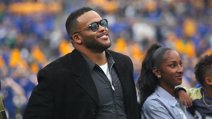 Former Pittsburgh Panther and retired NFL defensive tackle Aaron Donald watches the unveiling of his banner during his jersey number retirement ceremony during halftime of the Pittsburgh Panthers vs Notre Dame Fighting Irish game at Acrisure Stadium in Pittsburgh, PA on November 15, 2025.