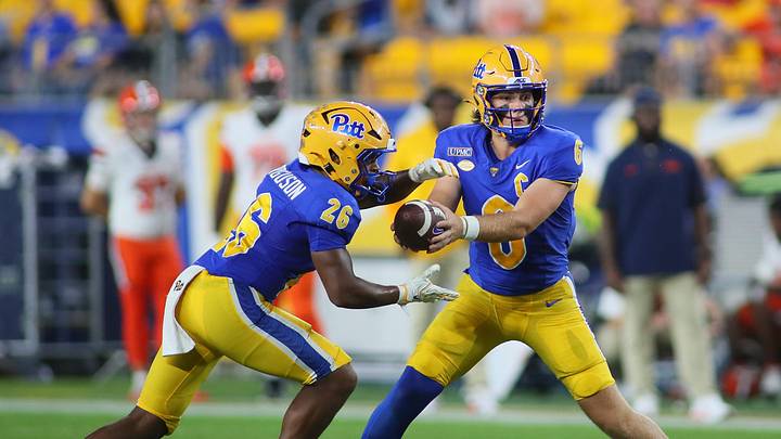 Pittsburgh Panthers quarterback Mason Heintschel (6) hands the ball off to running back Damon Ferguson Jr. (26) during the first half against the Syracuse Orange at Acrisure Stadium in Pittsburgh, PA on September 17, 2026. Pittsburgh Panthers quarterback Mason Heintschel (6) hands the ball off to running back Damon Ferguson Jr. (26) during the first half against the Syracuse Orange at Acrisure Stadium in Pittsburgh, PA on September 17, 2026.