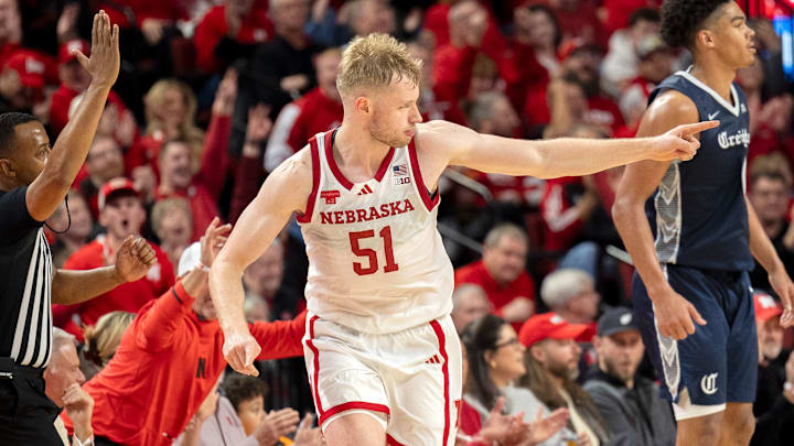 Nebraska forward Rienk Mast points after making a three-pointer against Creighton.