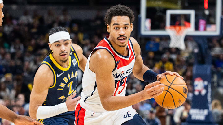 Jan 10, 2024; Indianapolis, Indiana, USA; Washington Wizards guard Jordan Poole (13) dribbles the ball while  Indiana Pacers guard Andrew Nembhard (2) defends in the first half at Gainbridge Fieldhouse. Mandatory Credit: Trevor Ruszkowski-Imagn Images