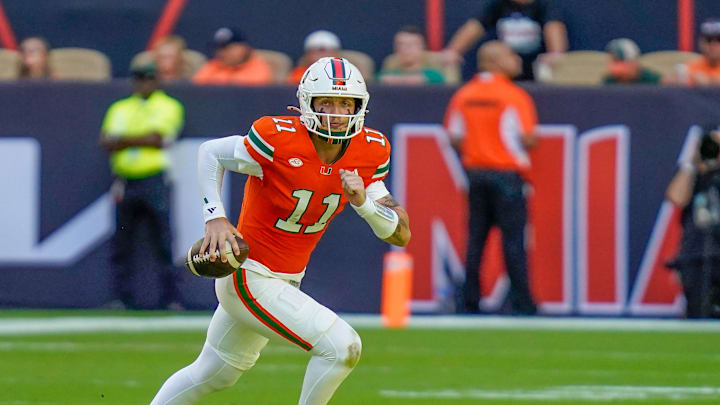 Nov 8, 2025; Miami Gardens, Florida, USA; Miami Hurricanes quarterback Carson Beck (11) rushes the ball against the Syracuse Orange during the first quarter at Hard Rock Stadium. Mandatory Credit: Jeff Romance-Imagn Images Nov 8, 2025; Miami Gardens, Florida, USA; Miami Hurricanes quarterback Carson Beck (11) rushes the ball against the Syracuse Orange during the first quarter at Hard Rock Stadium. Mandatory Credit: Jeff Romance-Imagn Images