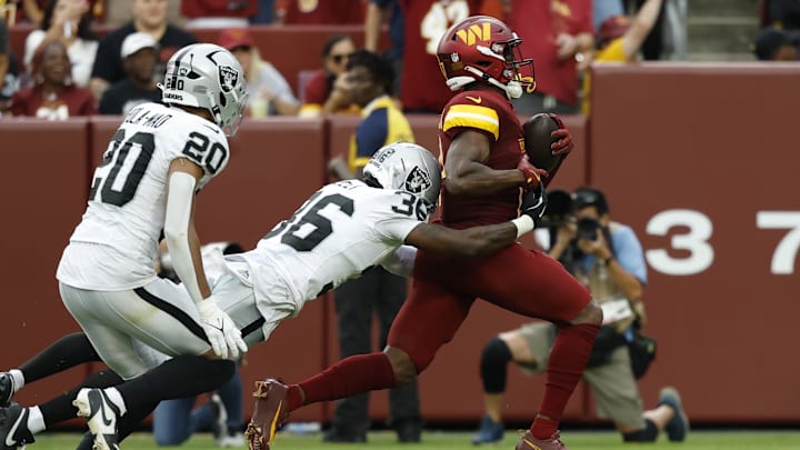 Sep 21, 2025; Landover, Maryland, USA; Washington Commanders wide receiver Terry McLaurin (17) runs with the ball after making a catch as Las Vegas Raiders cornerback Kyu Blu Kelly (36) dives to attempt a tackle during the third quarter at Northwest Stadium. Mandatory Credit: Geoff Burke-Imagn Images Sep 21, 2025; Landover, Maryland, USA; Washington Commanders wide receiver Terry McLaurin (17) runs with the ball after making a catch as Las Vegas Raiders cornerback Kyu Blu Kelly (36) dives to attempt a tackle during the third quarter at Northwest Stadium. Mandatory Credit: Geoff Burke-Imagn Images