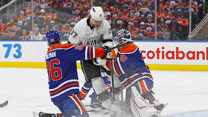 May 1, 2025; Edmonton, Alberta, CAN; Los Angeles Kings forward Warren Foegele (37) crashed into Edmonton Oilers goaltender Calvin Pickard (30) during the second period in game six of the first round of the 2025 Stanley Cup Playoffs at Rogers Place. Mandatory Credit: Perry Nelson-Imagn Images