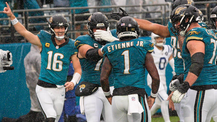 Jacksonville Jaguars running back Travis Etienne Jr. (1) is congratulated by teammates after a touchdown in the second quarter during an NFL football game at EverBank Stadium, Sunday, Dec. 7, 2025, in Jacksonville, Fla. [Doug Engle/Florida Times-Union]