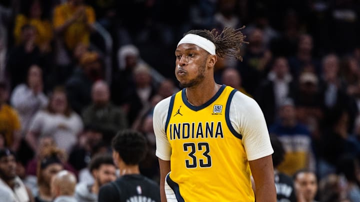 Mar 20, 2025; Indianapolis, Indiana, USA; Indiana Pacers center Myles Turner (33) celebrates the game winning block in the game against the Brooklyn Nets at Gainbridge Fieldhouse. Mandatory Credit: Trevor Ruszkowski-Imagn Images