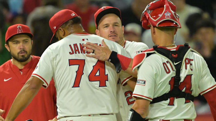 Angels relief pitcher Kenley Jansen (74) is congratulated by designated hitter Mike Trout (27) after earning a save in the ninth inning defeating the Texas Rangers at Angel Stadium on July 28.