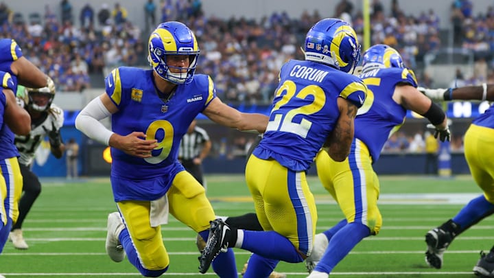 Nov 2, 2025; Inglewood, California, USA; Los Angeles Rams quarterback Matthew Stafford (9) hands off to running back Blake Corum (22) during the second half against the New Orleans Saints at SoFi Stadium. Mandatory Credit: Kiyoshi Mio-Imagn Images