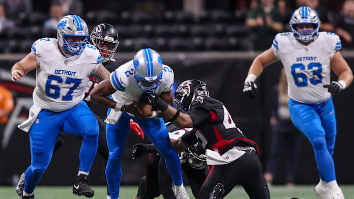 Detroit Lions quarterback Hendon Hooker (2) is stripped by Atlanta Falcons linebacker Josh Woods (42). Mandatory Credit: Brett Davis-Imagn Images