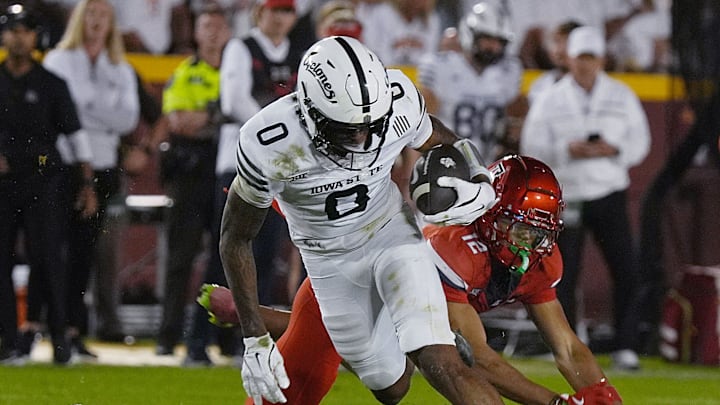 Iowa State Cyclones' wide receiver Chase Sowell (0) breaks a tackle from Arizona Wildcats defensive back Genesis Smith (12) after making a catch during the fourth quarter in the Big-12 conference showdown on Sept. 27, 2025, at Jack Trice Stadium in Ames, Iowa.
