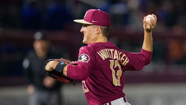 Florida State pitcher Conner Whittaker (13) pitches to a batter. 