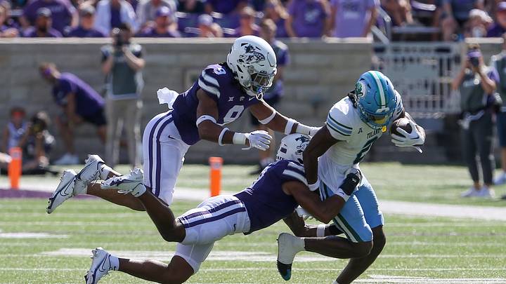 Sep 17, 2022; Manhattan, Kansas, USA; Tulane Green Wave wide receiver Duece Watts (2) is tackled by Kansas State Wildcats safety TJ Smith (7) and safety Cincere Mason (9) during the third quarter at Bill Snyder Family Football Stadium. Mandatory Credit: Scott Sewell-USA TODAY Sports Sep 17, 2022; Manhattan, Kansas, USA; Tulane Green Wave wide receiver Duece Watts (2) is tackled by Kansas State Wildcats safety TJ Smith (7) and safety Cincere Mason (9) during the third quarter at Bill Snyder Family Football Stadium. Mandatory Credit: Scott Sewell-USA TODAY Sports