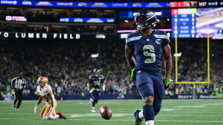 Jan 17, 2026; Seattle, WA, USA; Seattle Seahawks running back Kenneth Walker III (9) scores a touchdown against the San Francisco 49ers during the first half in an NFC Divisional Round game at Lumen Field. 