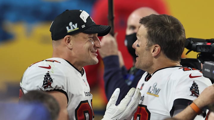 Tampa Bay Buccaneers quarterback Tom Brady (12) and tight end Rob Gronkowski (87) celebrate after defeating the Kansas City Chiefs in Super Bowl LV at Raymond James Stadium. 