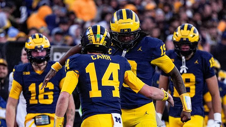Michigan quarterback Tommy Carr (14) celebrates his touchdown against Penn State with quarterback Bryce Underwood (19) during the second half at Michigan Stadium in Ann Arbor on Saturday, Oct. 17, 2026.