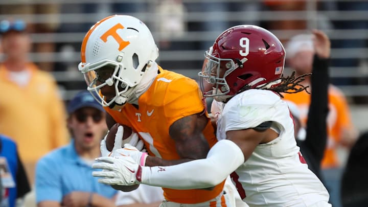 Oct 19, 2024; Knoxville, Tennessee, USA; Tennessee Volunteers wide receiver Dont'e Thornton Jr. (1) runs the ball against Alabama Crimson Tide defensive back Jaylen Mbakwe (9) during the second half at Neyland Stadium. 