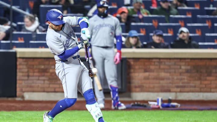 Toronto Blue Jays shortstop Bo Bichette (11) hits an RBI double in the sixth inning against the New York Mets at Citi Field in 2025.ainst the New York Mets at Citi Field in 2025.