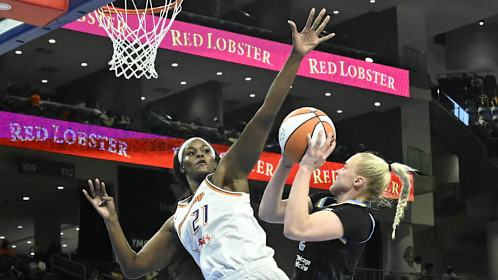 Jun 21, 2025; Chicago, Illinois, USA; Phoenix Mercury center Kalani Brown (21) defends against Chicago Sky guard Hailey Van Lith (2) during the second half at Wintrust Arena. Mandatory Credit: Matt Marton-Imagn Images