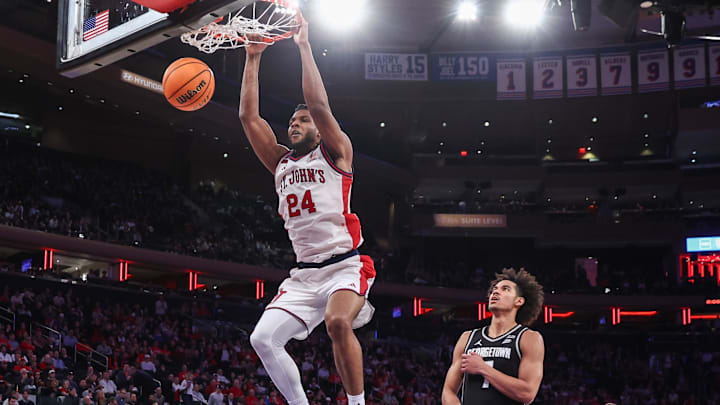 Mar 3, 2026; New York, New York, USA;  St. John's basketball forward Zuby Ejiofor (24) dunks past Georgetown Hoyas forward Isaiah Abraham (7) in the second half at Madison Square Garden.