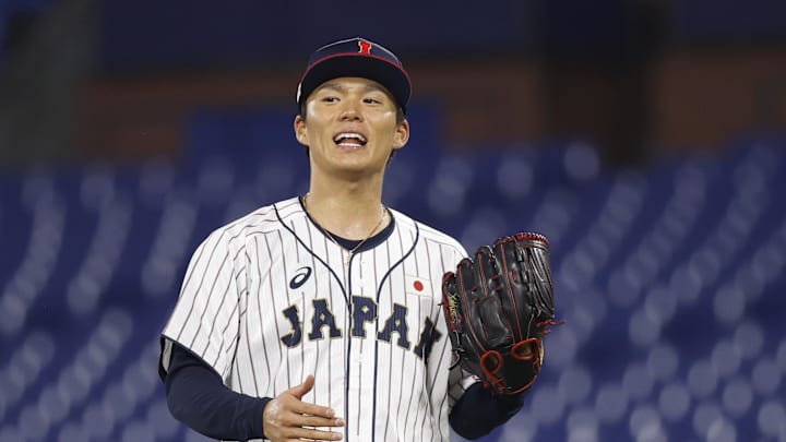 Aug 4, 2021; Yokohama, Japan; Team Japan pitcher Yoshinobu Yamamoto (17) reacts against Korea in a