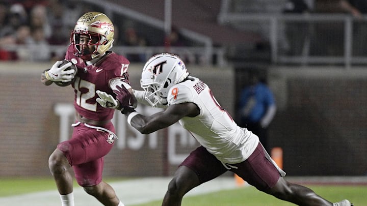 Nov 15, 2025; Tallahassee, Fla; Florida State running back Jaylin Lucas (12) is pushed out of bounds.