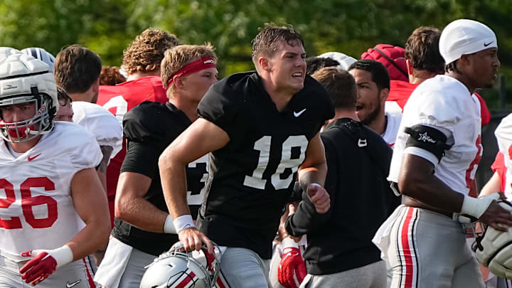 Aug 8, 2024; Columbus, Ohio, USA; Ohio State Buckeyes quarterback Will Howard (18) runs during football practice at the Woody Hayes Athletic Complex.