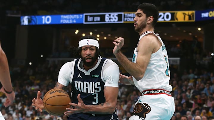 Dallas Mavericks forward Anthony Davis drives to the basket against Memphis Grizzlies forward Santi Aldama.