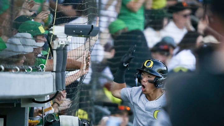 Oregon infielder Rikuu Nishida celebrates after scoring a game tying run in the fourth inning during an NCAA college baseball tournament Super Regional game Saturday, June 10, 2023, in Eugene, Ore. Oral Roberts won 8-7.