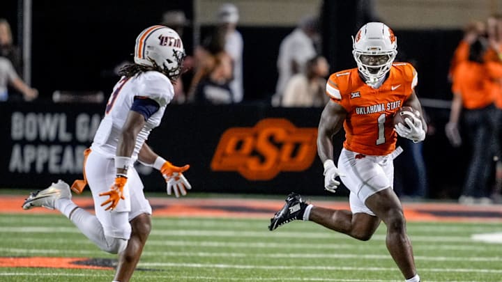 Oklahoma State running back Kalib Hicks (1) runs the ball in the fourth quarter during an NCAA football game between Oklahoma State (OSU) and UT Martin in Stillwater, Okla., on Thursday, Aug. 28, 2025.