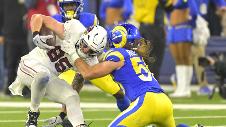 Arizona Cardinals tight end Trey McBride is stopped by Los Angeles Rams linebacker Christian Rozeboom. Arizona Cardinals tight end Trey McBride is stopped by Los Angeles Rams linebacker Christian Rozeboom.