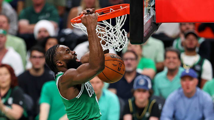 Jun 17, 2024; Boston, Massachusetts, USA; Boston Celtics guard Jaylen Brown (7) dunks the ball against the Dallas Mavericks in game five of the 2024 NBA Finals at TD Garden. Mandatory Credit: Peter Casey-Imagn Images