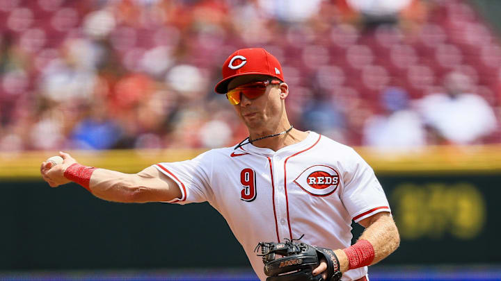 Jun 4, 2025; Cincinnati, Ohio, USA; Cincinnati Reds second baseman Matt McLain (9) throws to first to get Milwaukee Brewers shortstop Joey Ortiz (not pictured) out in the fourth inning at Great American Ball Park. Mandatory Credit: Katie Stratman-Imagn Images