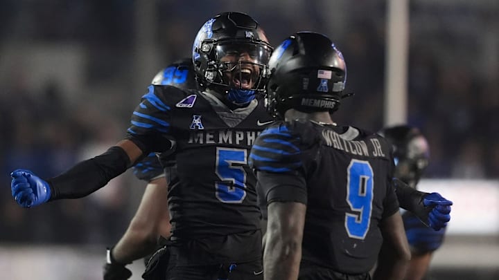 Memphis' Chris Bracy (5) celebrates with William Whitlow Jr. (9) after the defense made a stop during the game between Memphis and Tulane at Simmons Bank Liberty Stadium in Memphis, Tenn., on November 7, 2025.