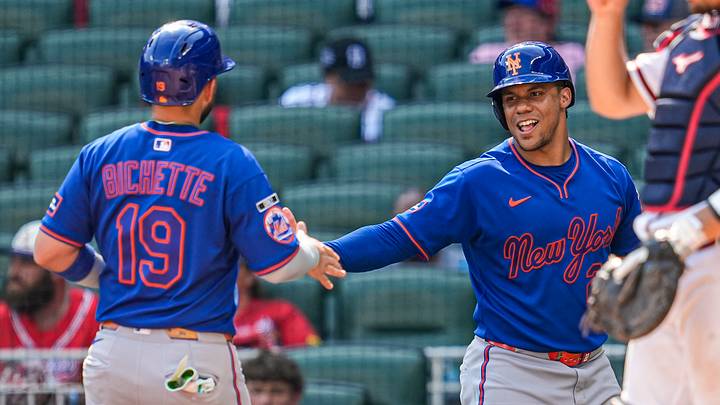 Mets third baseman Bo Bichette and designated hitter Juan Soto (22) react after both scoring runs against the Atlanta Braves. Mets third baseman Bo Bichette and designated hitter Juan Soto (22) react after both scoring runs against the Atlanta Braves.