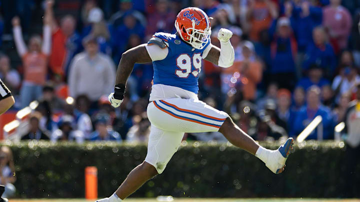 Nov 23, 2024; Gainesville, Florida, USA; Florida Gators defensive lineman Cam Jackson (99) celebrates after a sack against the Mississippi Rebels during the first half at Ben Hill Griffin Stadium. Mandatory Credit: Matt Pendleton-Imagn Images