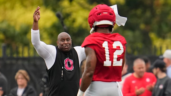 Ohio State Buckeyes running backs coach Carlos Locklyn works with running back CJ Donaldson (12) during the first football practice of the season at the Woody Hayes Athletic Center on July 31, 2025.
