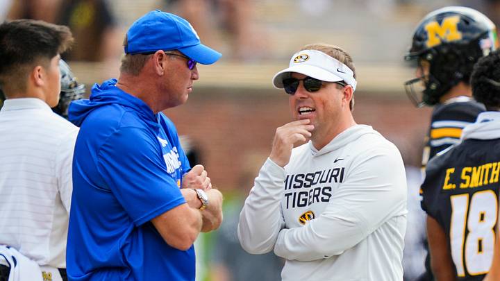 Sep 6, 2025; Columbia, Missouri, USA; Kansas Jayhawks head coach Lance Leipold talks with Missouri Tigers head coach Eliah Drinkwitz prior to a game at Faurot Field at Memorial Stadium. Mandatory Credit: Jay Biggerstaff-Imagn Images Sep 6, 2025; Columbia, Missouri, USA; Kansas Jayhawks head coach Lance Leipold talks with Missouri Tigers head coach Eliah Drinkwitz prior to a game at Faurot Field at Memorial Stadium. Mandatory Credit: Jay Biggerstaff-Imagn Images