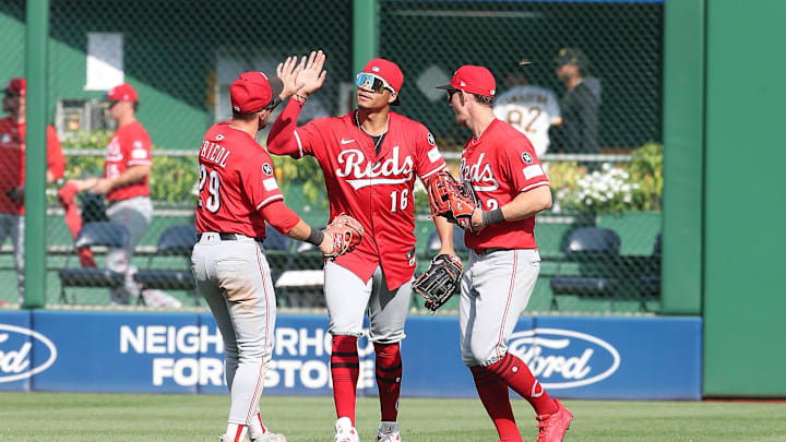Aug 10, 2025; Pittsburgh, Pennsylvania, USA;  Cincinnati Reds center fielder outfielder TJ Friedl (29) and right fielder Noelvi Marte (16) and left fielder Austin Hays (right) celebrate in the outfield after defeating the Pittsburgh Pirates at PNC Park. Mandatory Credit: Charles LeClaire-Imagn Images