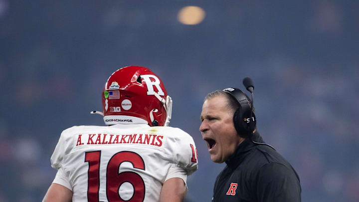 Dec 26, 2024; Phoenix, AZ, USA; Rutgers Scarlet Knights head coach Greg Schiano celebrates a touchdown with quarterback Athan Kaliakmanis (16) against the Kansas State Wildcats during the Rate Bowl at Chase Field. Mandatory Credit: Mark J. Rebilas-Imagn Images