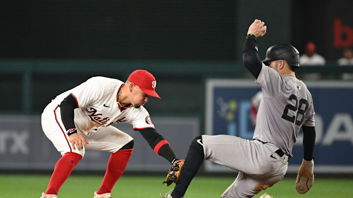 Aug 26, 2024; Washington, District of Columbia, USA; Washington Nationals second baseman Ildemaro Vargas (14) tags out New York Yankees catcher Austin Wells (28) at second base during the seventh inning at Nationals Park. Mandatory Credit: Rafael Suanes-Imagn Images